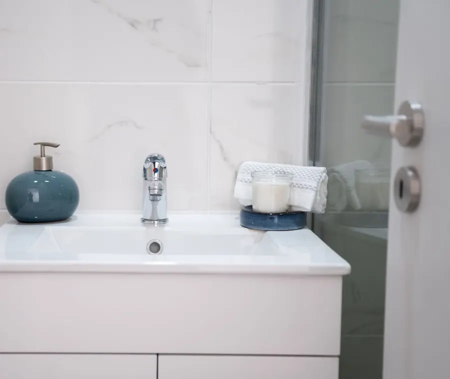 Finished bathroom sink with a chrome tap and clean fittings